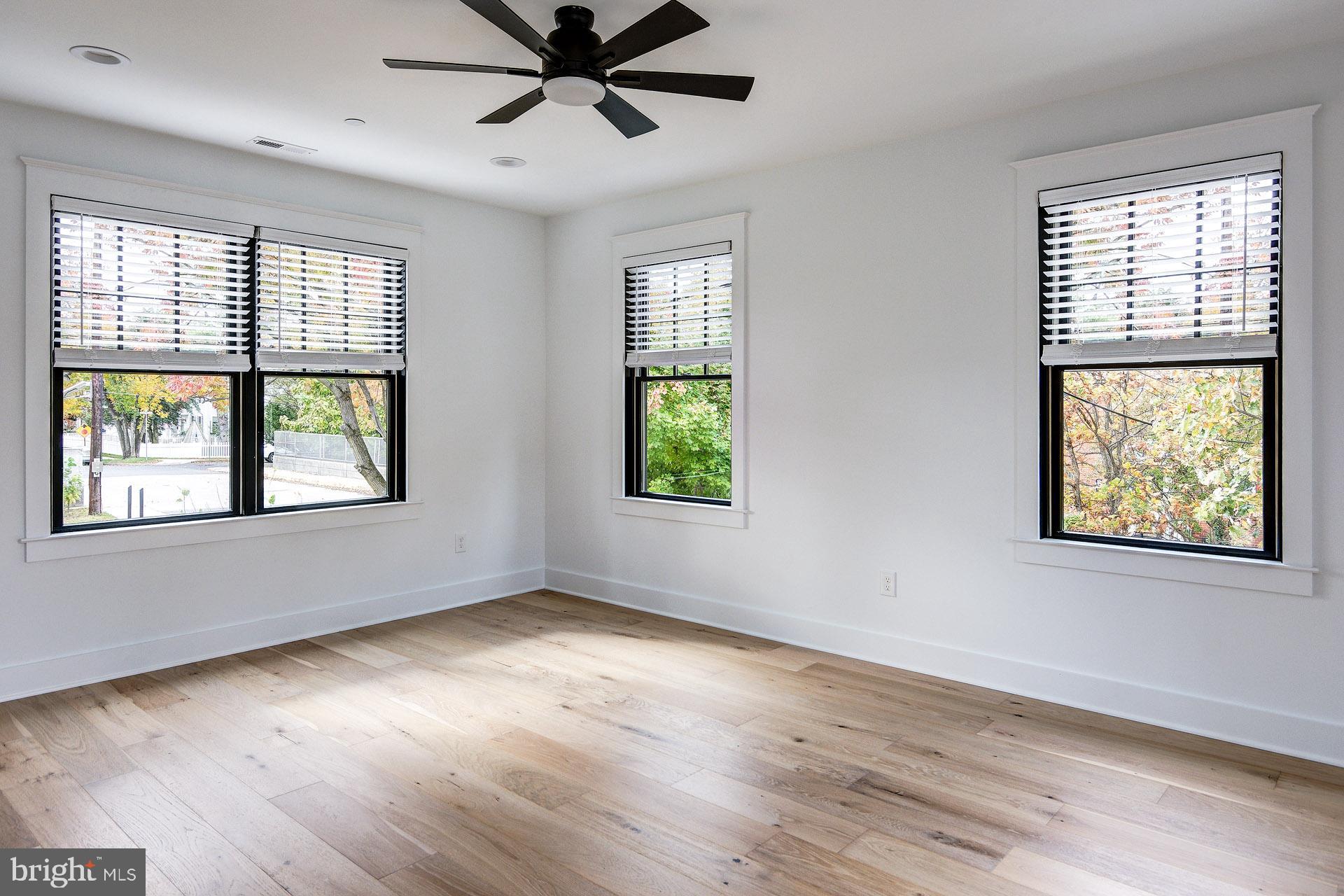 20 East Redman Avenue, Unit D Haddonfield, NJ 08033 - Photo 22 of 43 a view of an empty room with wooden floor and a window