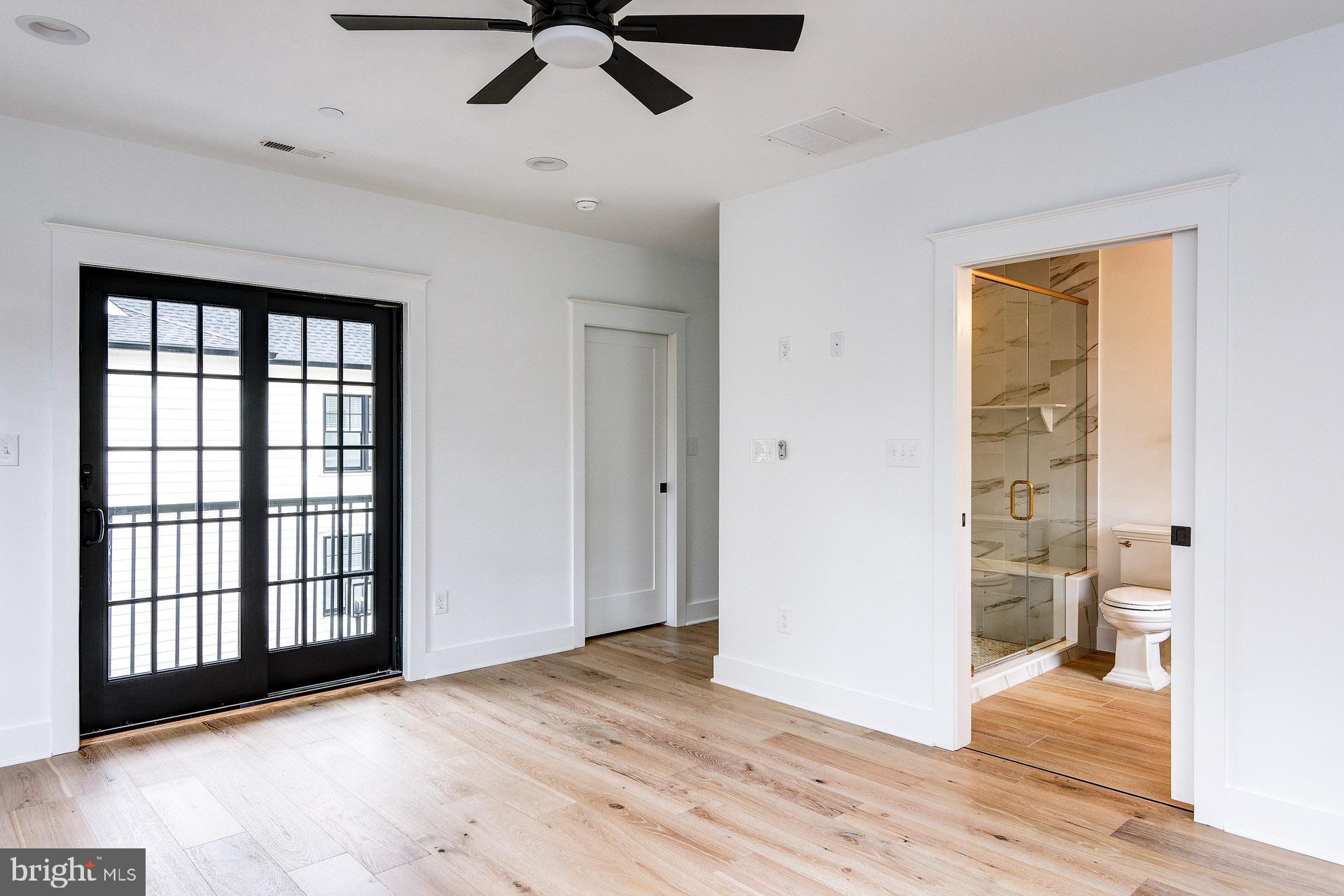 20 East Redman Avenue, Unit D Haddonfield, NJ 08033 - Photo 24 of 43 a view of a room with a hardwood floor and a ceiling fan