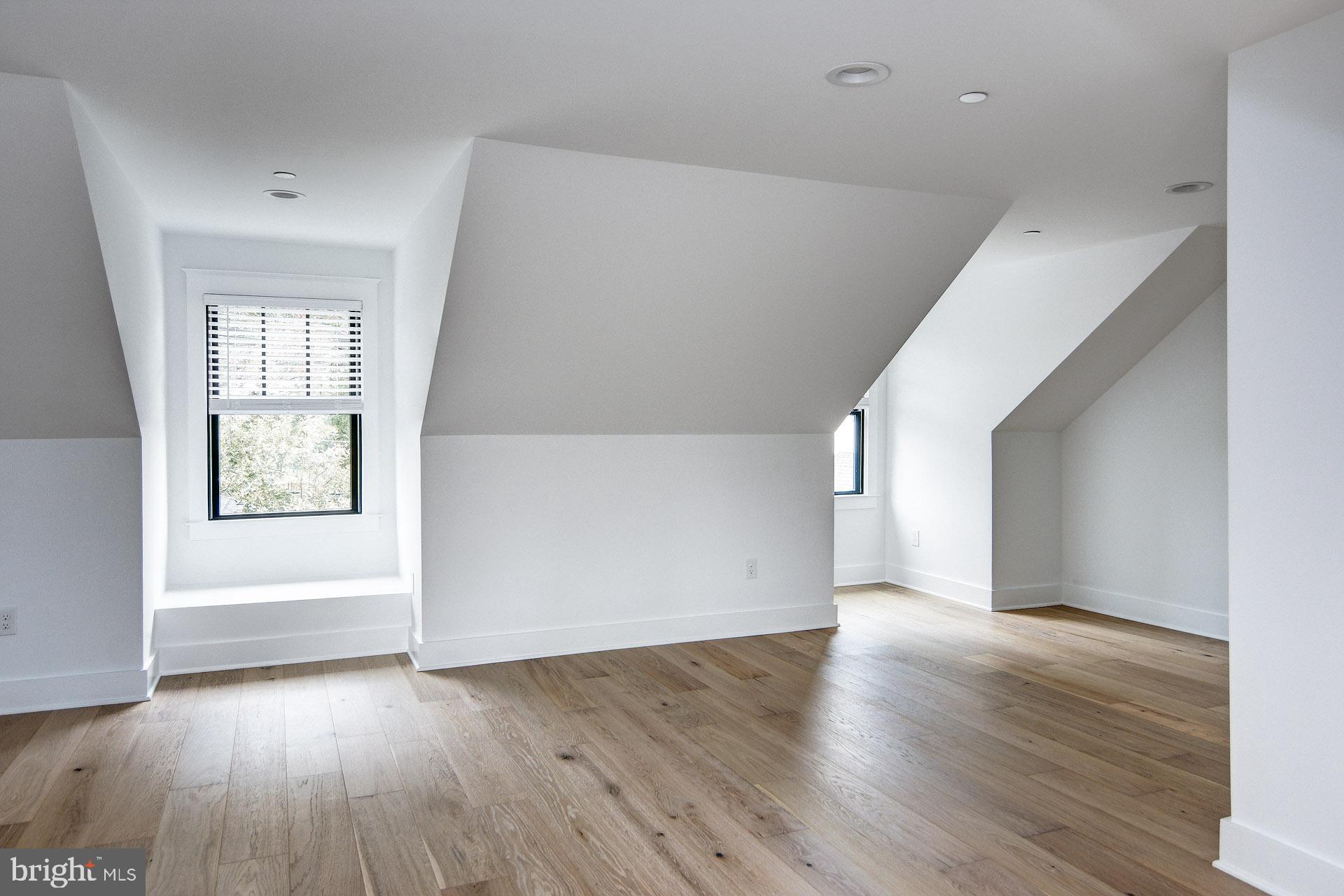 20 East Redman Avenue, Unit D Haddonfield, NJ 08033 - Photo 41 of 43 an empty room with wooden floor and windows