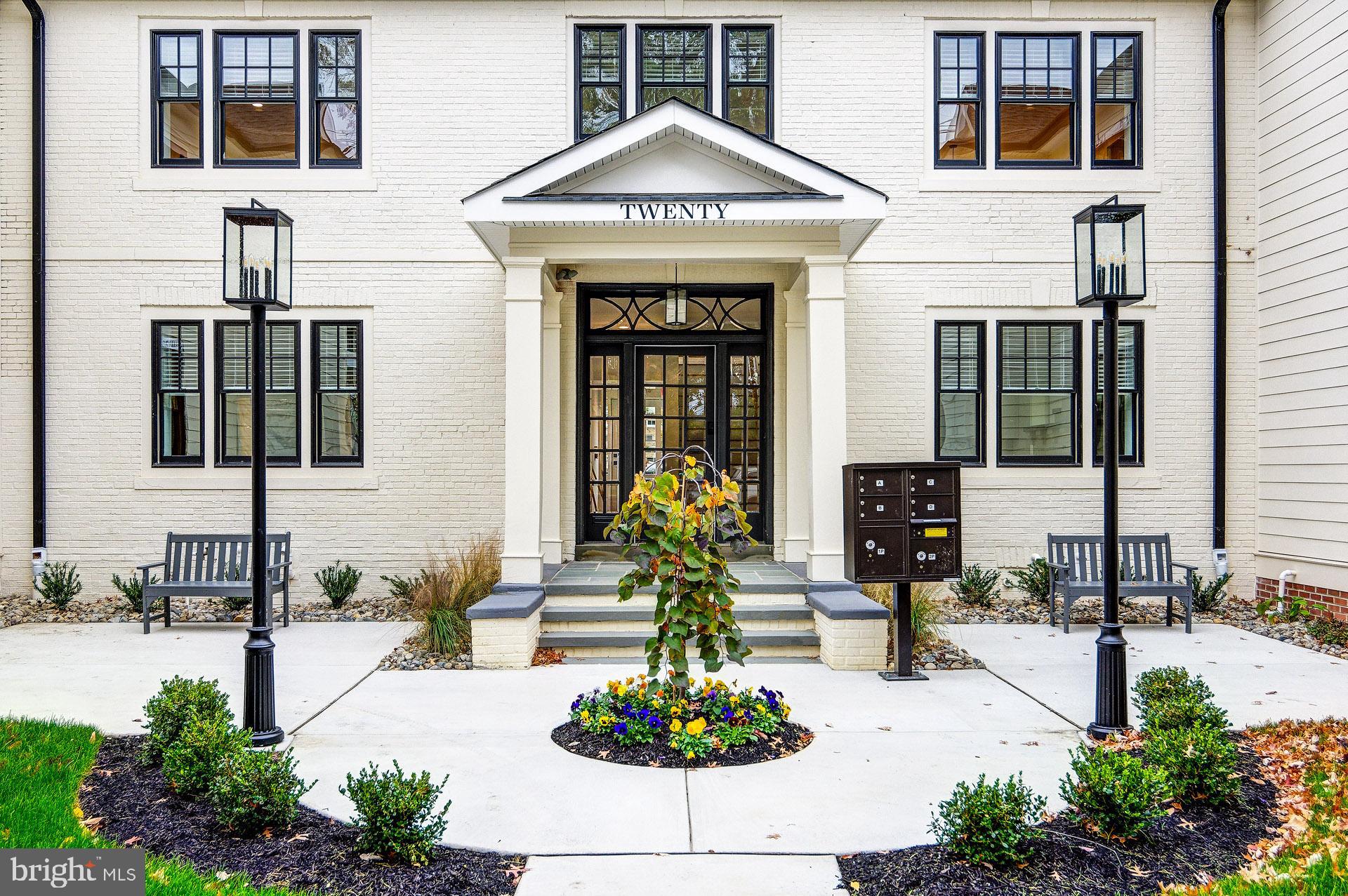 20 East Redman Avenue, Unit D Haddonfield, NJ 08033 - Photo 7 of 43 a front view of a building with glass windows