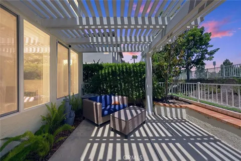 a view of balcony with furniture