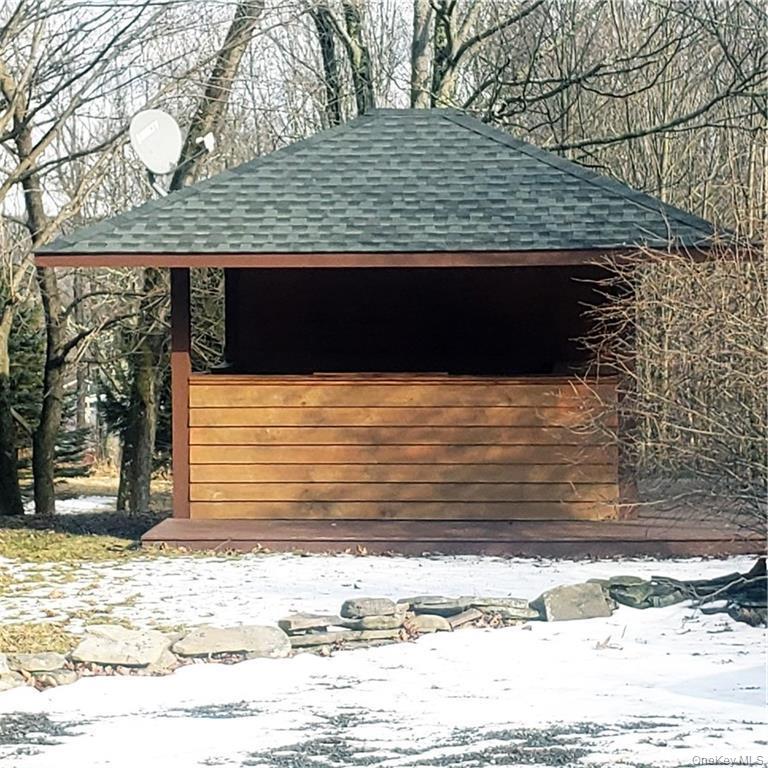 179 Old Turnpike Road Woodridge, NY 12789 - Photo 2 of 14 a view of a wooden door and a yard