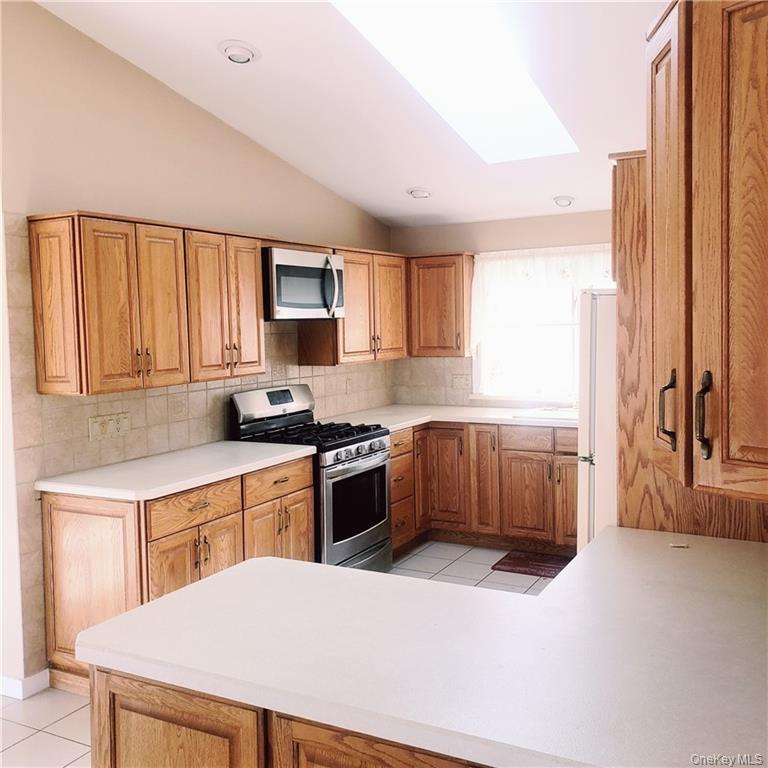 179 Old Turnpike Road Woodridge, NY 12789 - Photo 6 of 14 a kitchen with a sink a stove and a refrigerator