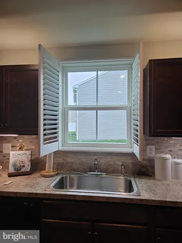 a kitchen with a sink and a window