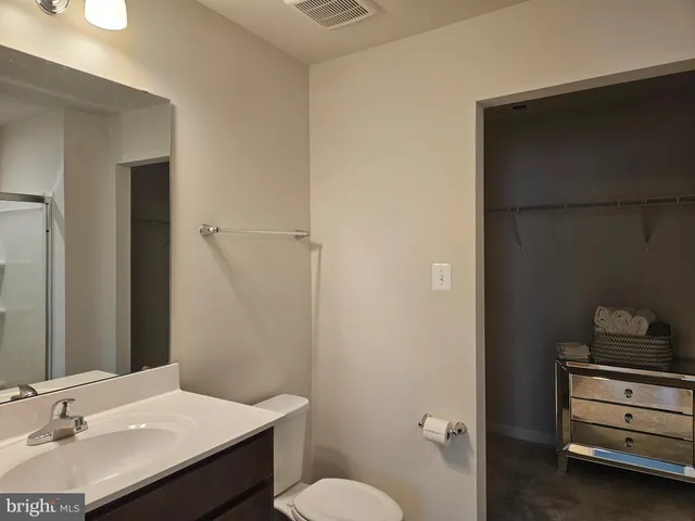a bathroom with a glass shower door