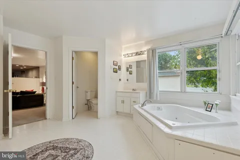a bathroom with a bathtub and a sink