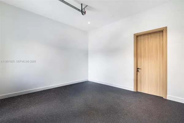 a view of room and bedroom with a ceiling fan
