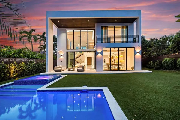 a view of an house with swimming pool and porch with furniture