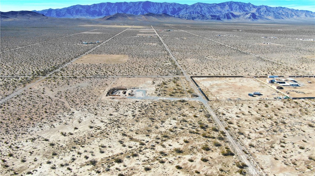 4 Spring Valley Tecopa, CA 92389 - Photo 11 of 14 a view of a dry yard with wooden fence