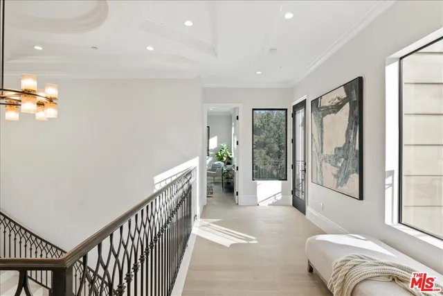 a bedroom with a large bed and a large window