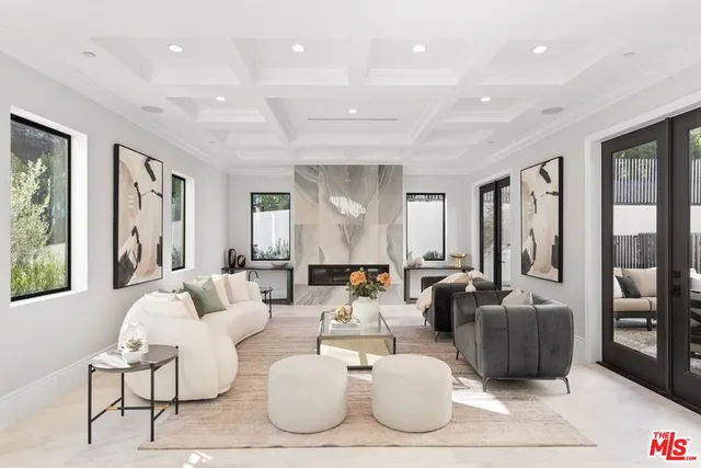 a dining room with furniture a livingroom and chandelier