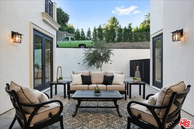 a aerial view of a house with a yard basket ball court and outdoor seating