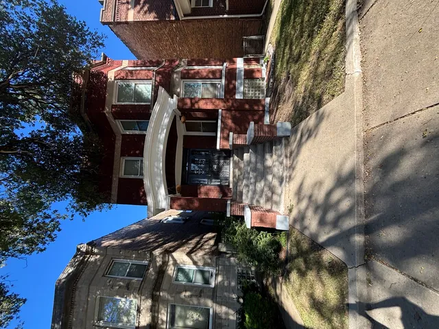 a view of balcony with table and chairs