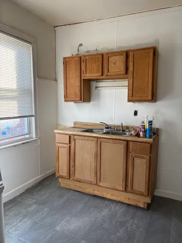 a kitchen with stainless steel appliances granite countertop a sink and cabinets