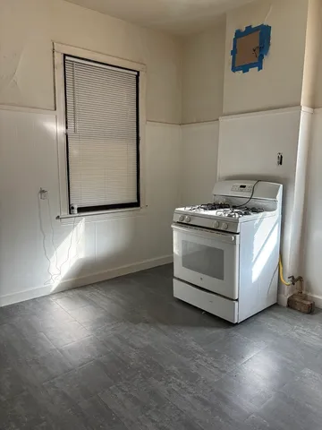 a kitchen with a stove and a microwave