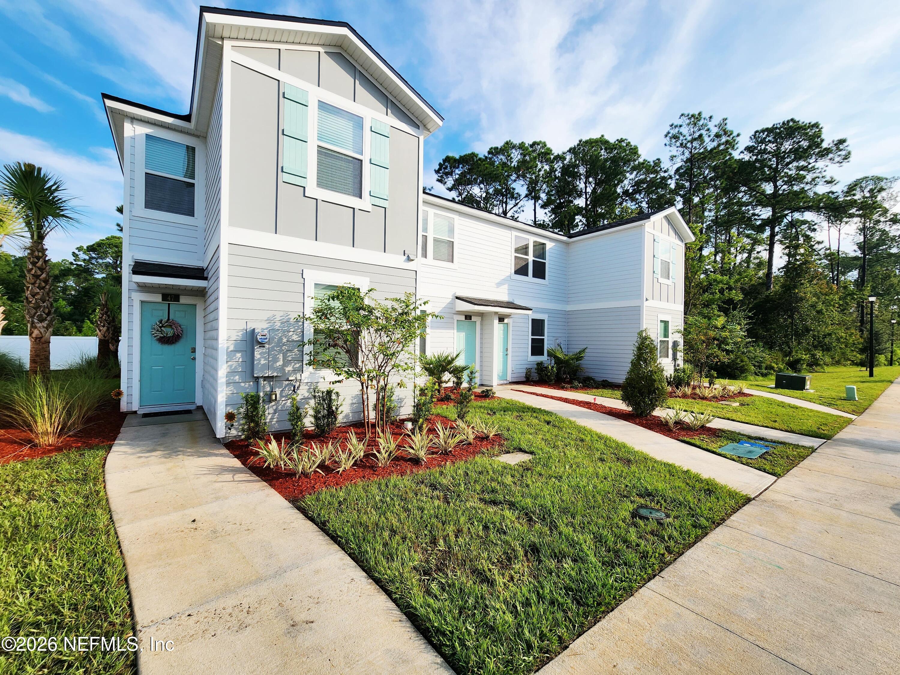 51 Palmetto Rdg Road St. Augustine, FL 32095 - Photo 1 of 16 front view of a house with a yard