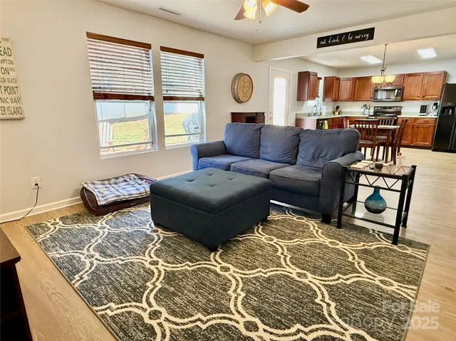 a living room with furniture and a large window