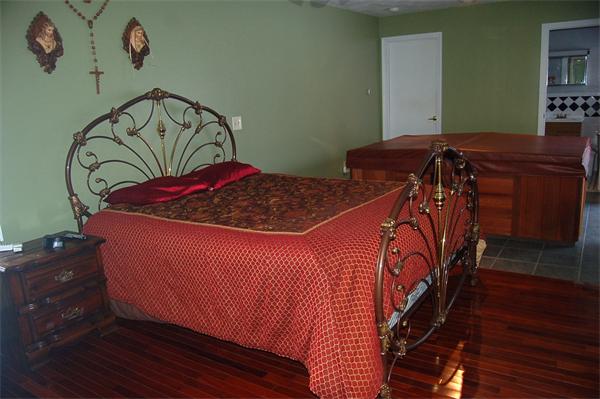 1047 Great Road Lincoln, RI 02865 - Photo 9 of 17 a bedroom with a bed and a dresser