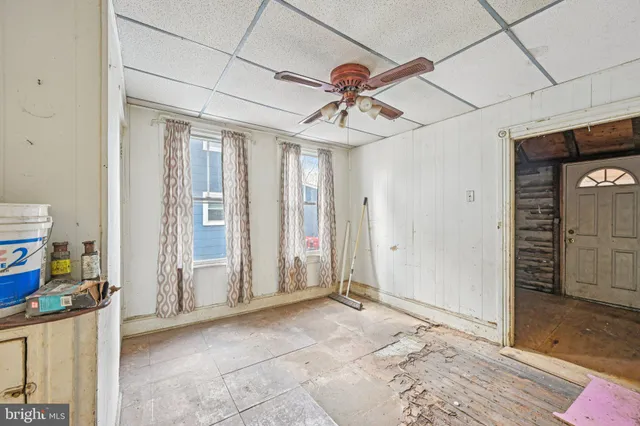 a view of a livingroom with a furniture and chandelier fan
