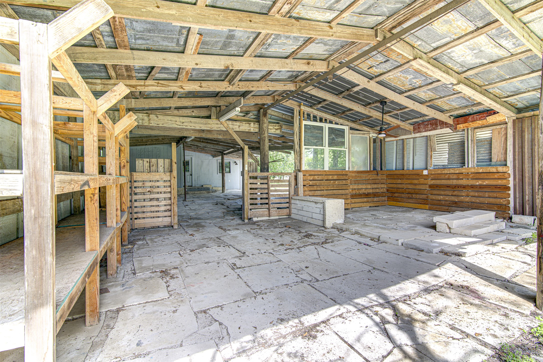 1807 San Jose Street Georgetown, TX 78626 - Photo 16 of 21 An outdoor covered space with concrete flooring offers ample room for storage and customization.