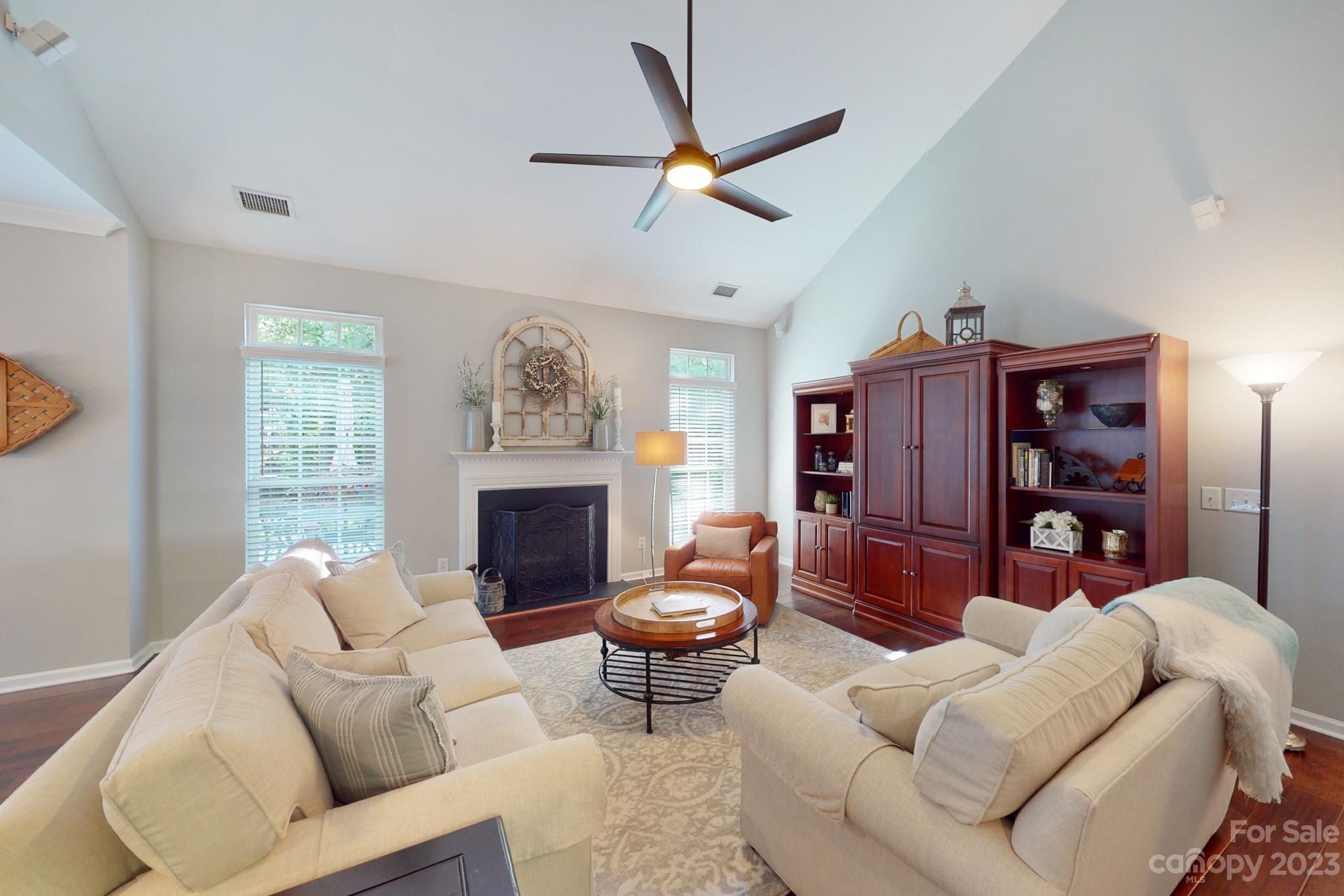 16022 Lavenham Road Huntersville, NC 28078 - Photo 13 of 35 a living room with furniture a fireplace and a window