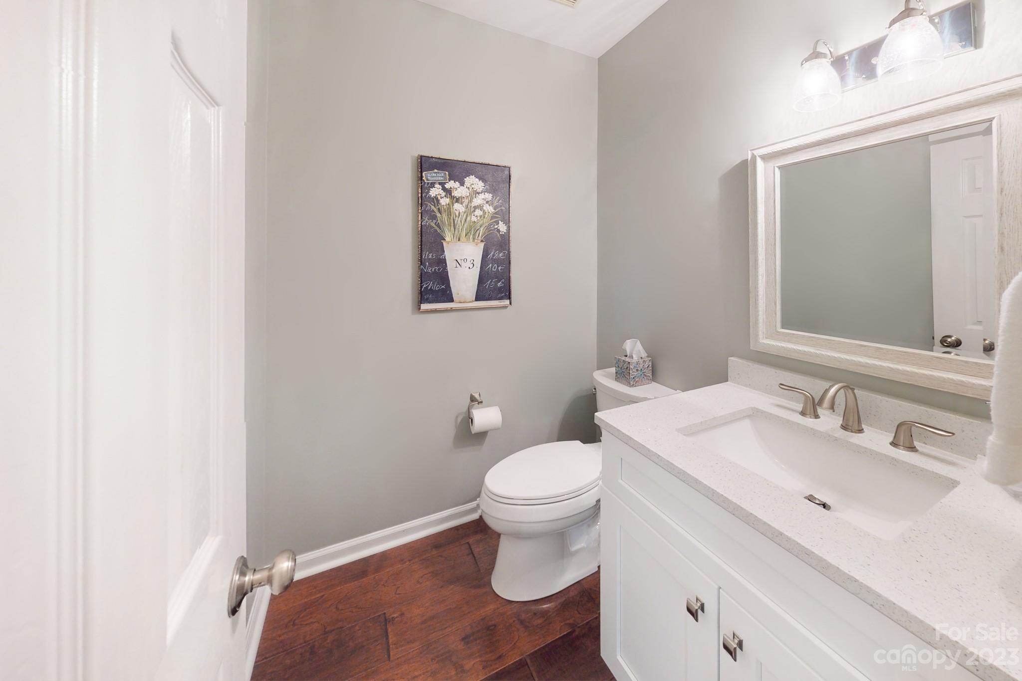 16022 Lavenham Road Huntersville, NC 28078 - Photo 15 of 35 a bathroom with a toilet sink and mirror