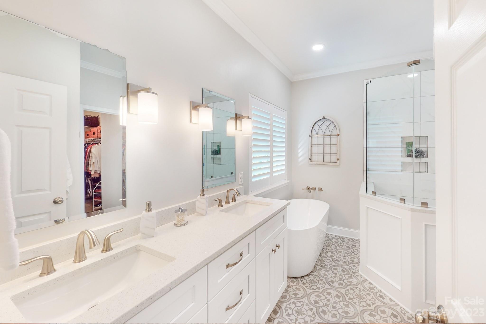 16022 Lavenham Road Huntersville, NC 28078 - Photo 19 of 35 a bathroom with a double vanity sink mirror and double