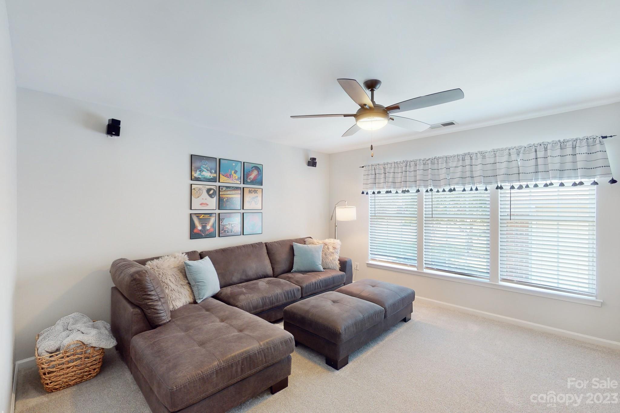 16022 Lavenham Road Huntersville, NC 28078 - Photo 22 of 35 a living room with furniture and a large window