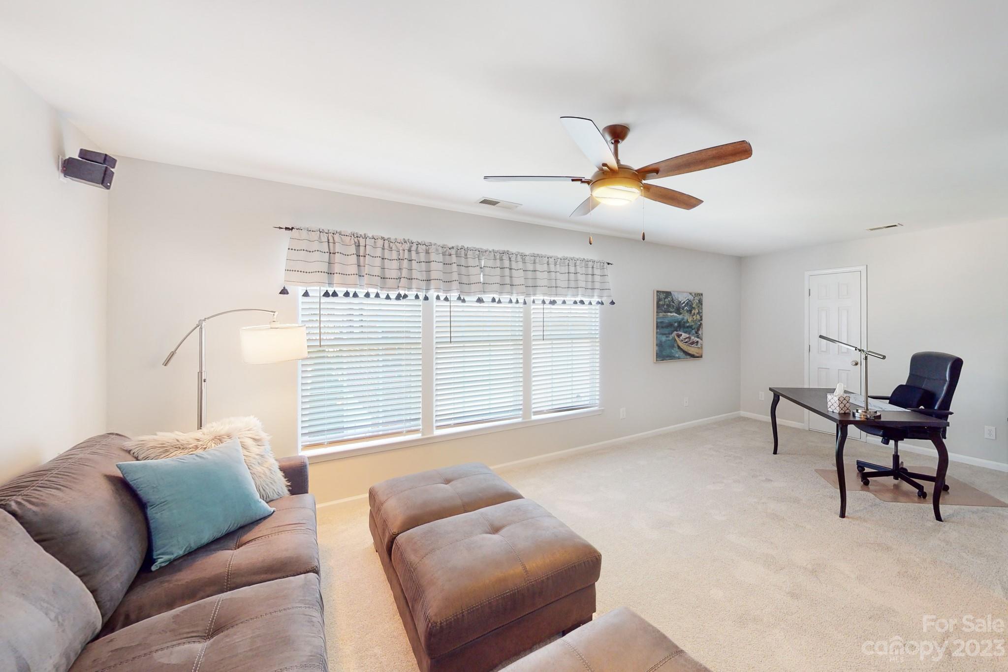 16022 Lavenham Road Huntersville, NC 28078 - Photo 23 of 35 a living room with furniture and a large window
