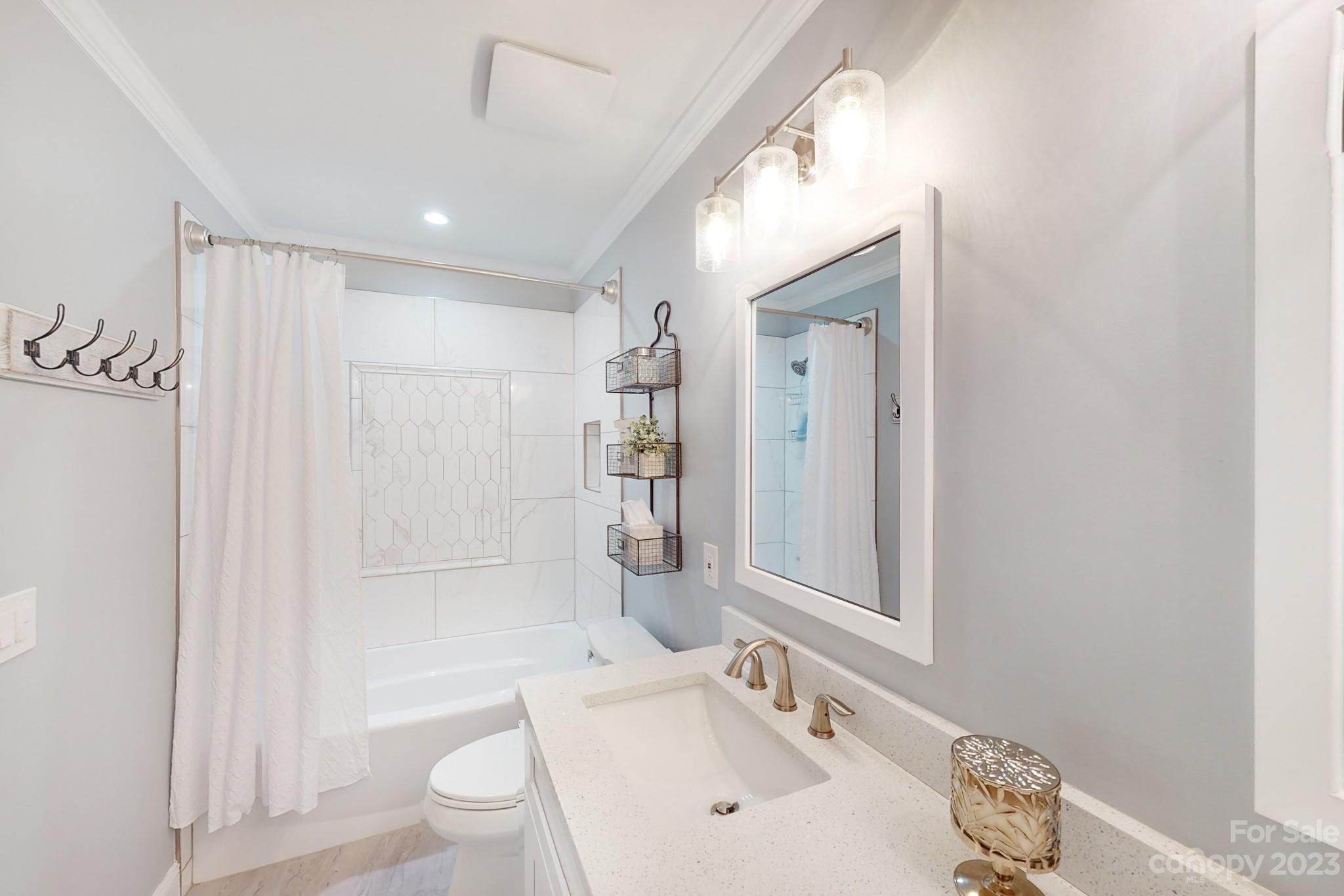 16022 Lavenham Road Huntersville, NC 28078 - Photo 26 of 35 a bathroom with a sink a toilet and shower