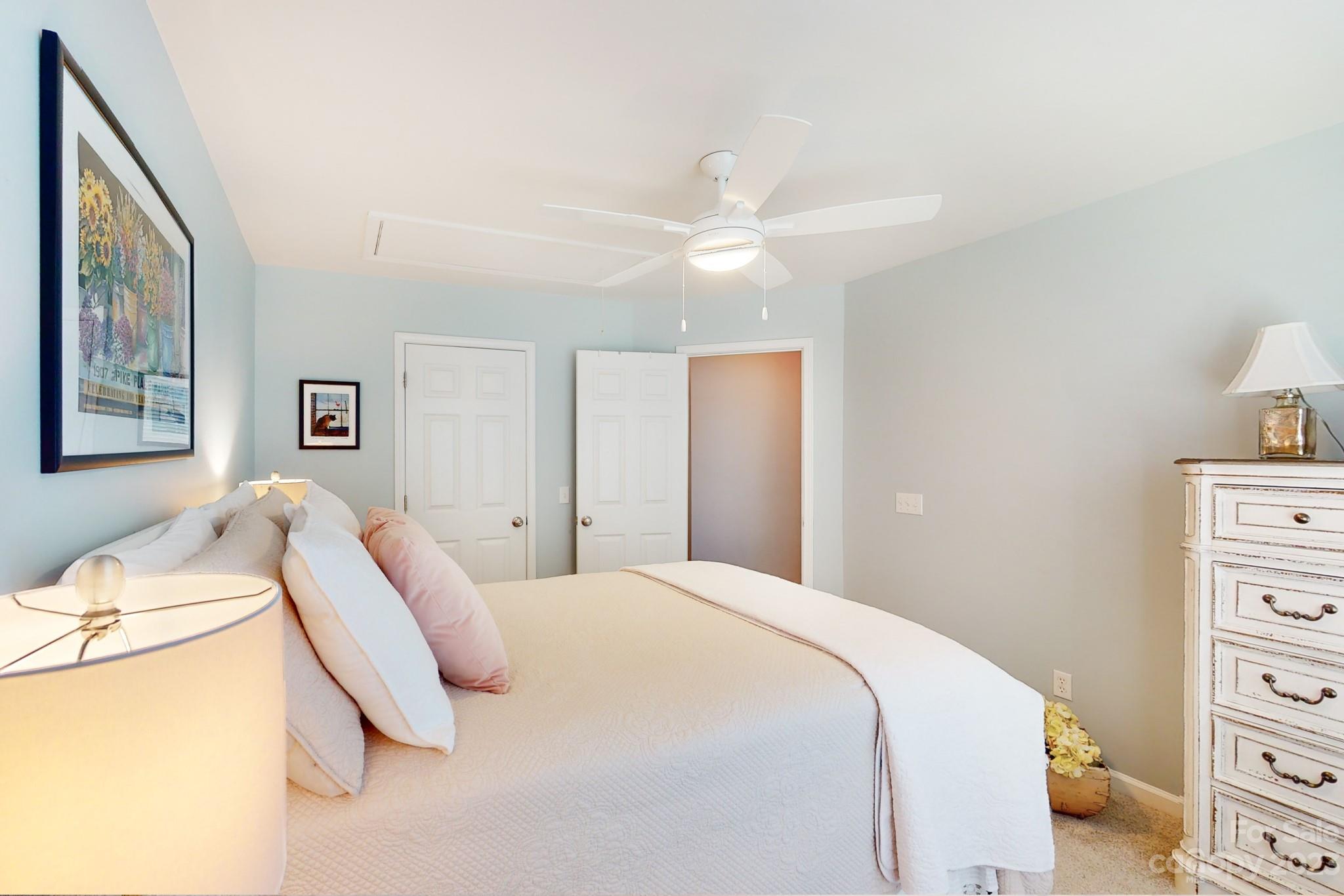 16022 Lavenham Road Huntersville, NC 28078 - Photo 28 of 35 a bedroom with a bed and closet with chair