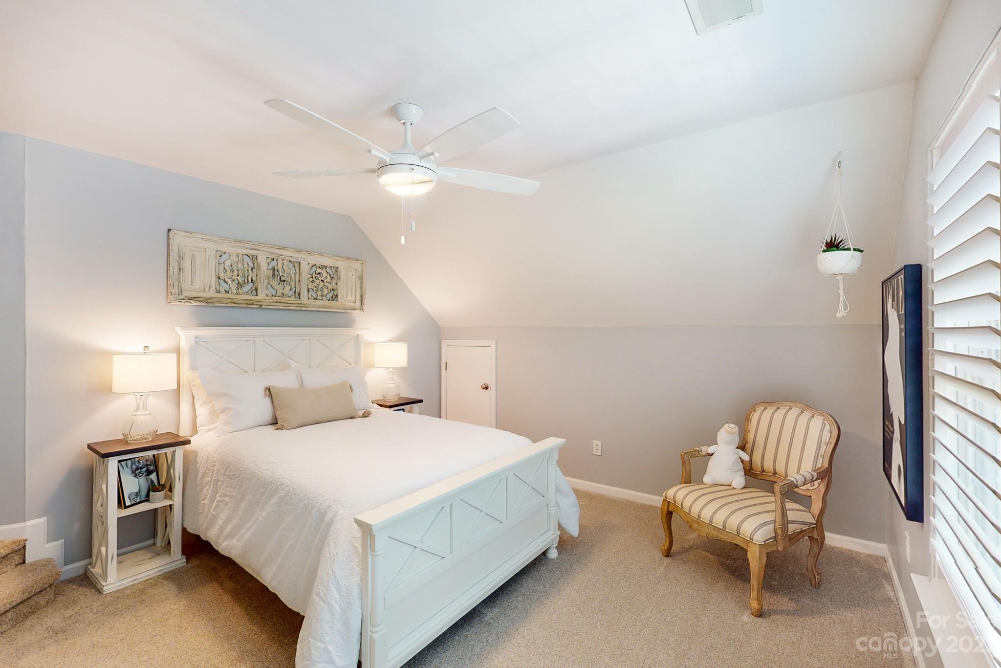16022 Lavenham Road Huntersville, NC 28078 - Photo 29 of 35 a bedroom with a bed and a chair