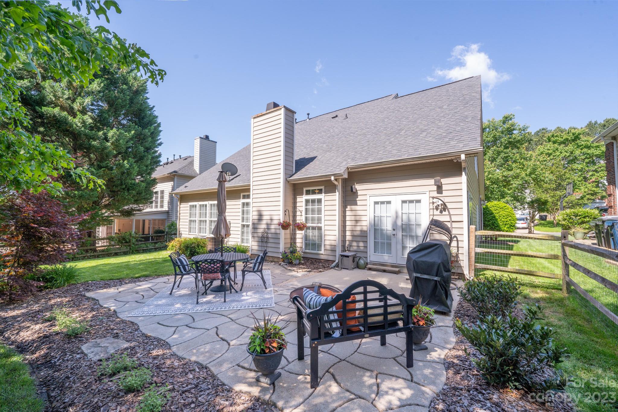 16022 Lavenham Road Huntersville, NC 28078 - Photo 32 of 35 a view of a backyard with sitting area and garden