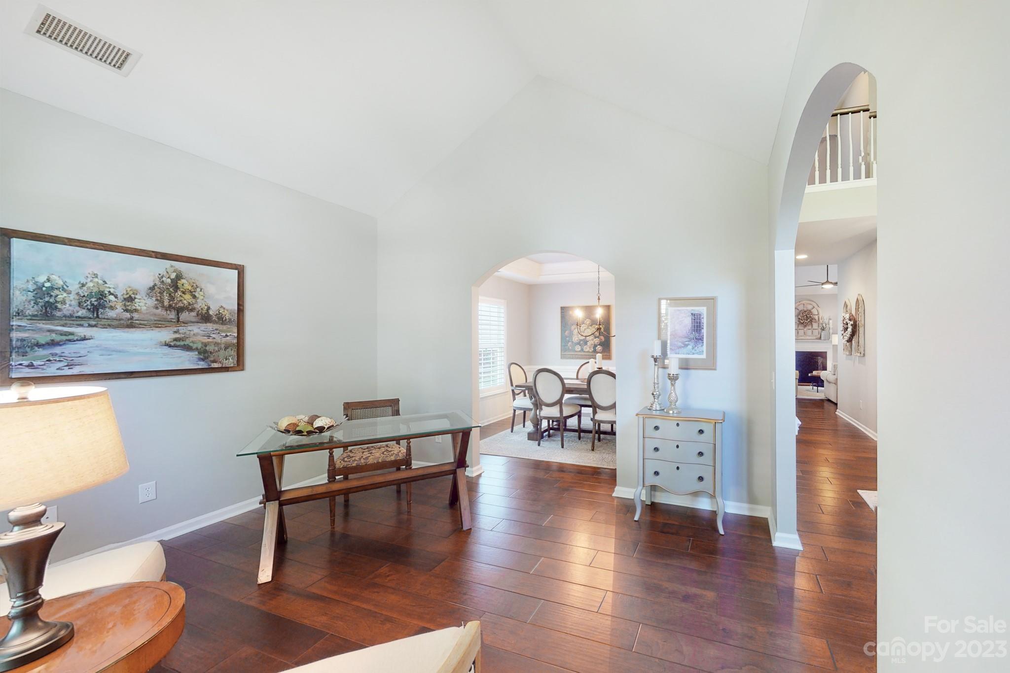 16022 Lavenham Road Huntersville, NC 28078 - Photo 5 of 35 a view of a livingroom with furniture and a workspace