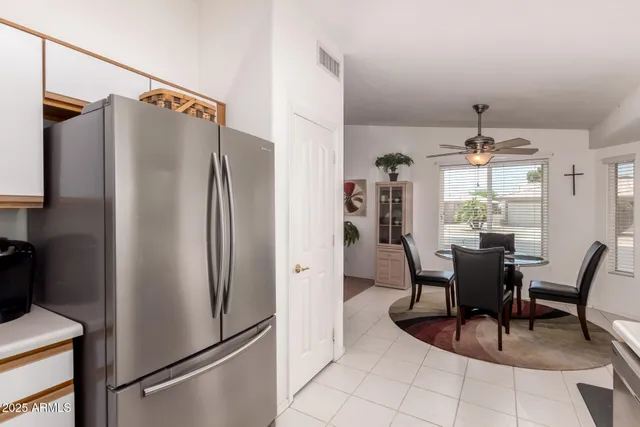 a kitchen with stainless steel appliances a refrigerator and microwave