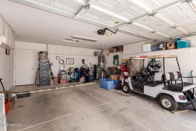 a view of a garage with a bike and car