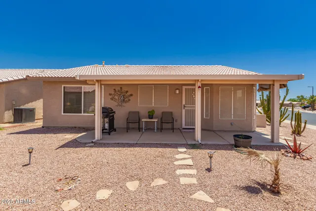 a house view with a backyard space