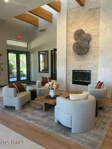 a living room with furniture and a fireplace