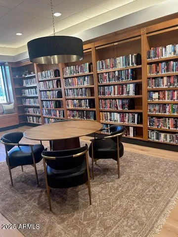 a reading room with furniture and book shelf