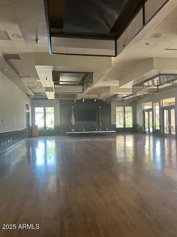 a view of a room with lots of wooden furniture