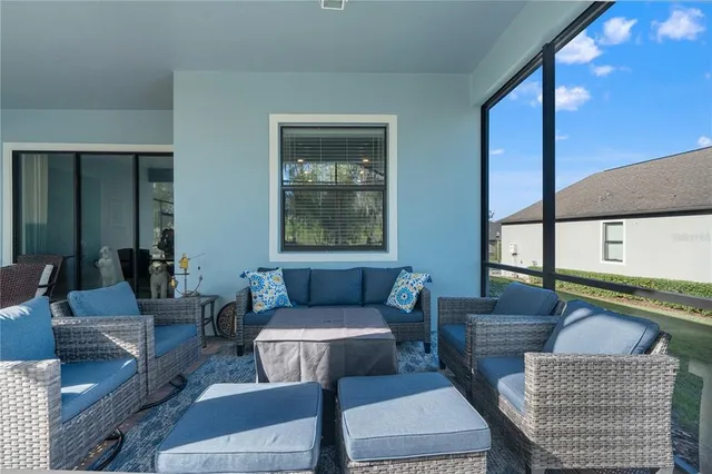 a backyard of a house with lots of green space and fountain