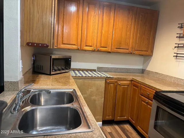 a kitchen with a sink and cabinets