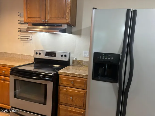 a close up of a stove top oven sitting inside of a kitchen