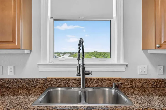 a view of a swimming pool with a table and chairs