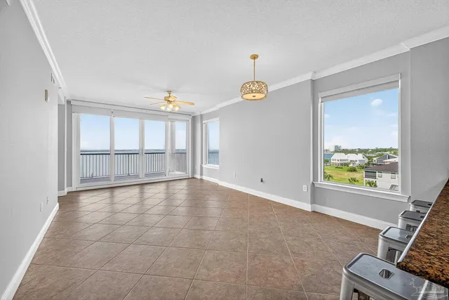a kitchen with granite countertop a sink and cabinets