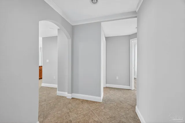 a kitchen with stainless steel appliances granite countertop a refrigerator and a stove