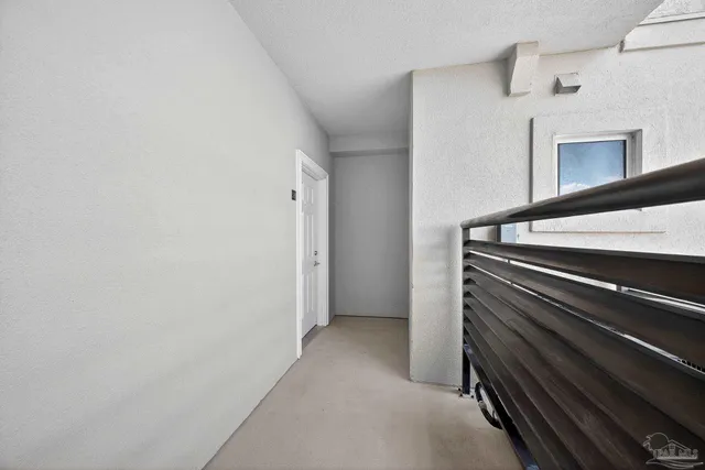 a view of a hallway with washer and dryer