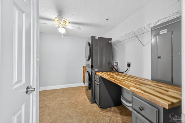 a view of a kitchen and an empty room