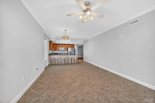a view of a kitchen with a refrigerator and a sink
