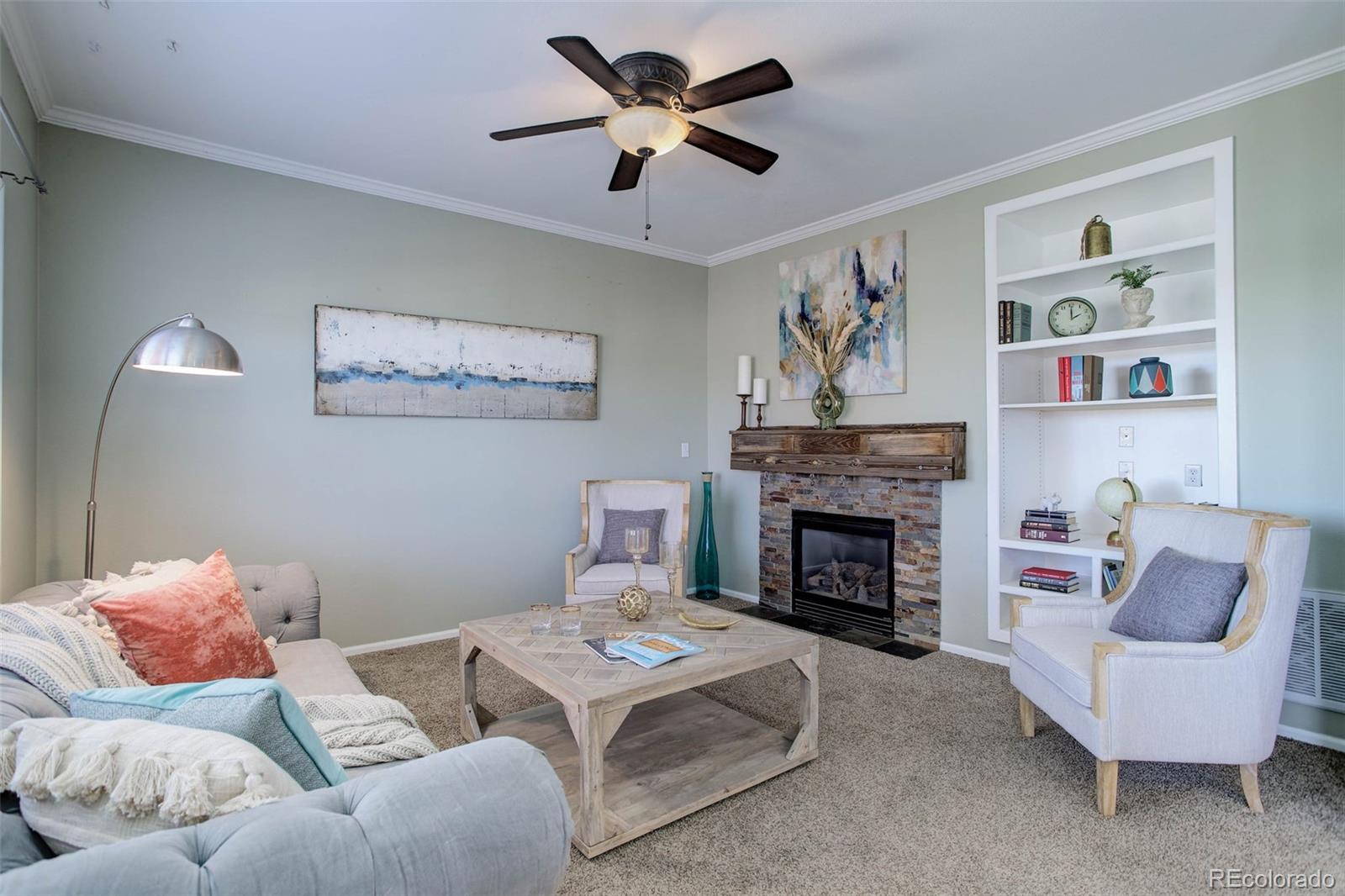 2471 South Andes Circle Aurora, CO 80013 - Photo 13 of 35 a living room with furniture and a fireplace